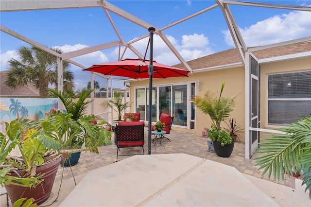 view of patio / terrace featuring a lanai