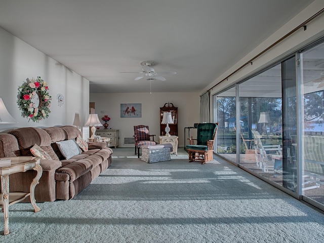 carpeted living room featuring ceiling fan