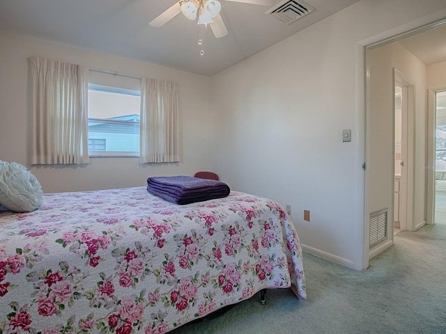 bedroom with ceiling fan and light colored carpet