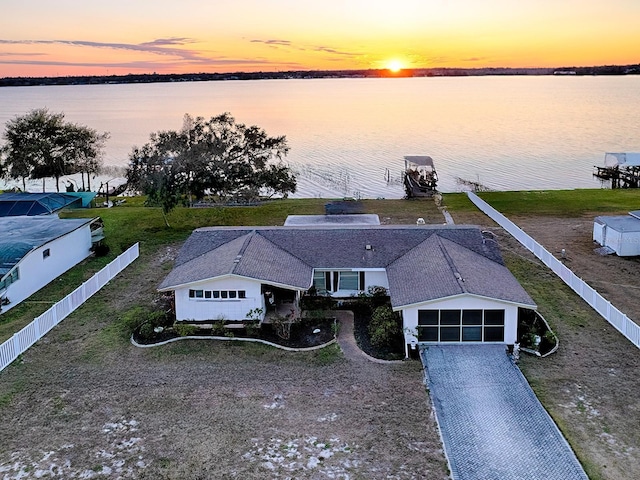 aerial view at dusk with a water view