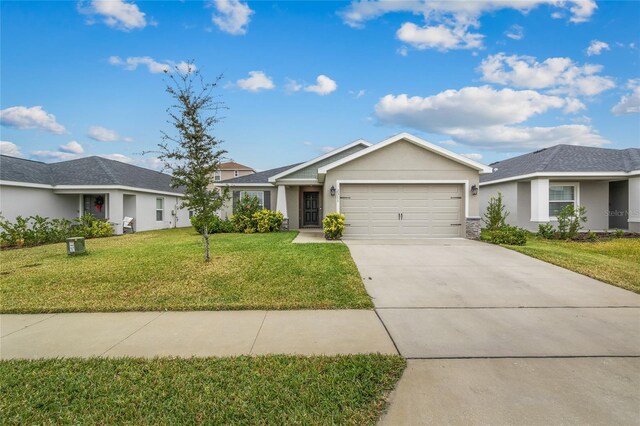 ranch-style home with a garage and a front yard