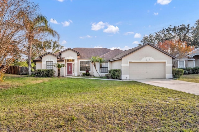 single story home with a garage and a front yard