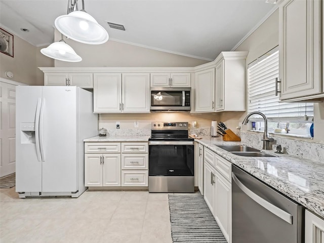 kitchen with a healthy amount of sunlight, sink, white cabinets, and appliances with stainless steel finishes