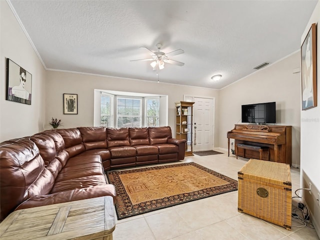 living room with lofted ceiling, light tile patterned floors, a textured ceiling, and ceiling fan