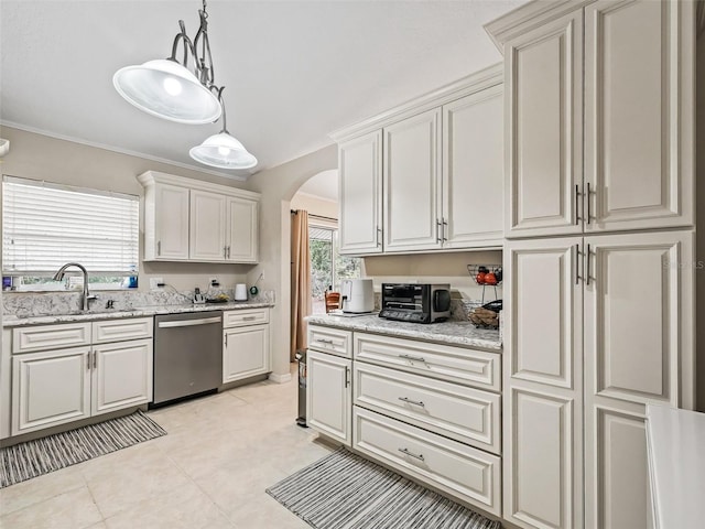 kitchen featuring white cabinetry, sink, hanging light fixtures, stainless steel dishwasher, and light stone counters