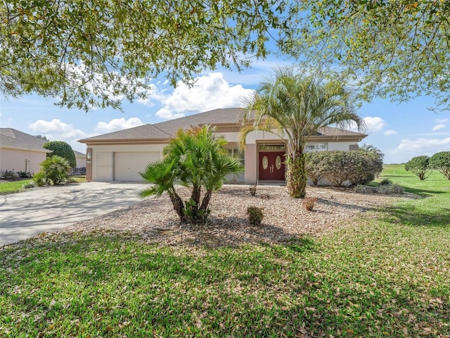 ranch-style house featuring a garage and a front yard