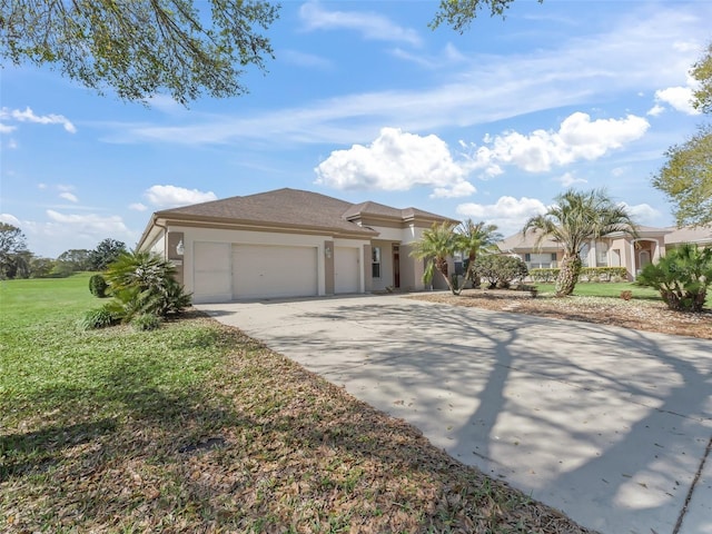 view of front of property featuring a garage and a front yard