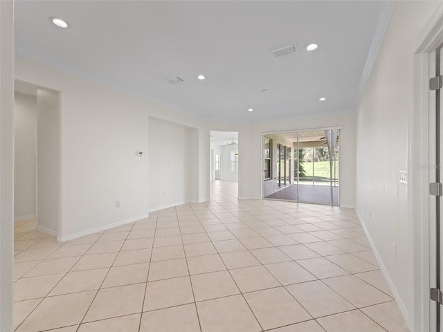 tiled empty room with ornamental molding