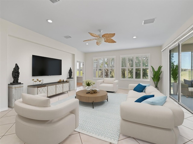 living room with light tile patterned floors and ceiling fan