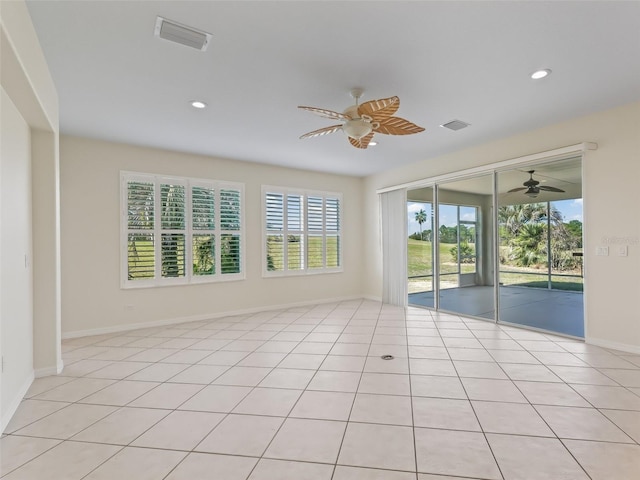 spare room with light tile patterned floors and ceiling fan