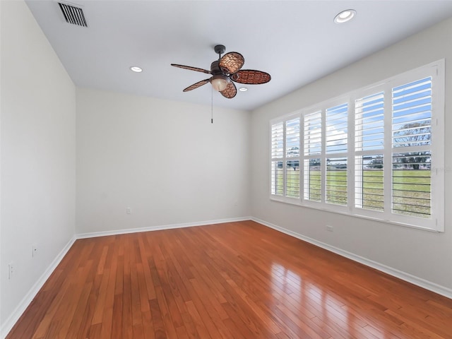 unfurnished room featuring hardwood / wood-style floors and ceiling fan