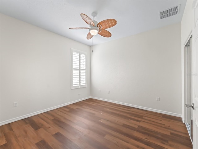 unfurnished bedroom featuring dark wood-type flooring and ceiling fan