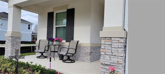 view of patio featuring a porch