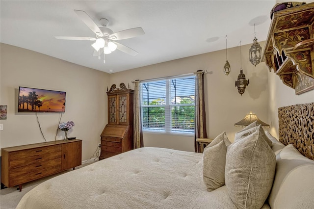 carpeted bedroom featuring a ceiling fan