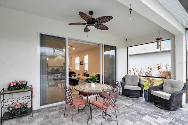 view of patio featuring outdoor dining space and a ceiling fan