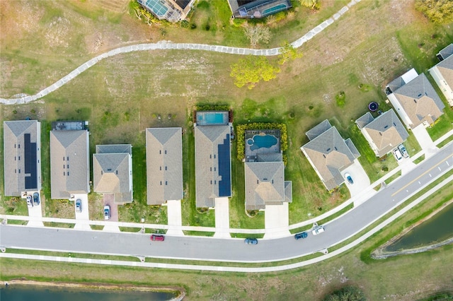 aerial view featuring a residential view and a water view