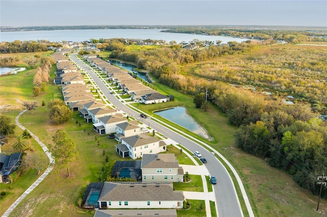 birds eye view of property with a residential view and a water view