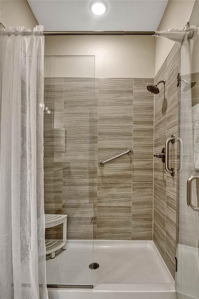 full bathroom featuring a shower stall