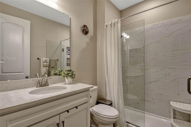 full bath with curtained shower, vanity, and toilet