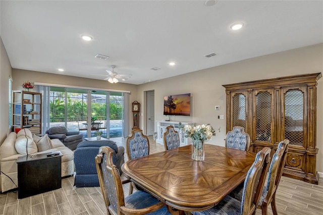 dining room featuring a ceiling fan, wood tiled floor, visible vents, and recessed lighting