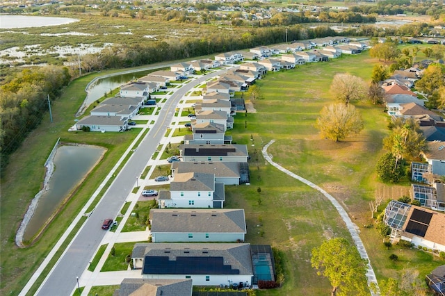 birds eye view of property featuring a residential view and a water view