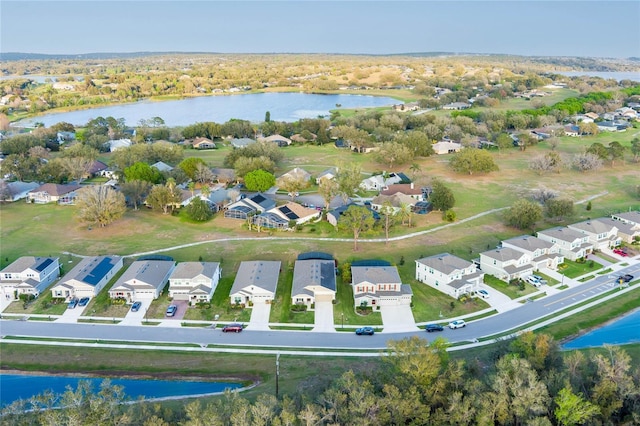 bird's eye view with a water view and a residential view