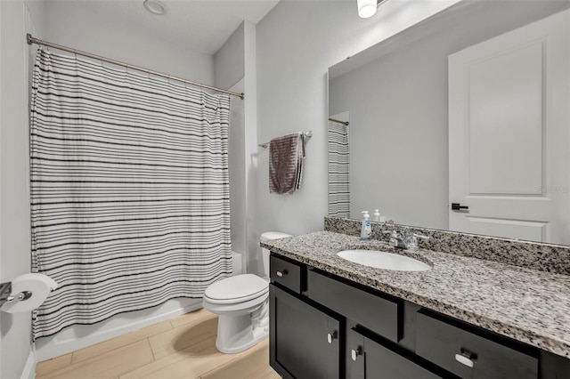 full bathroom featuring vanity, toilet, and shower / tub combo with curtain