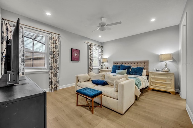 bedroom featuring ceiling fan and light hardwood / wood-style flooring