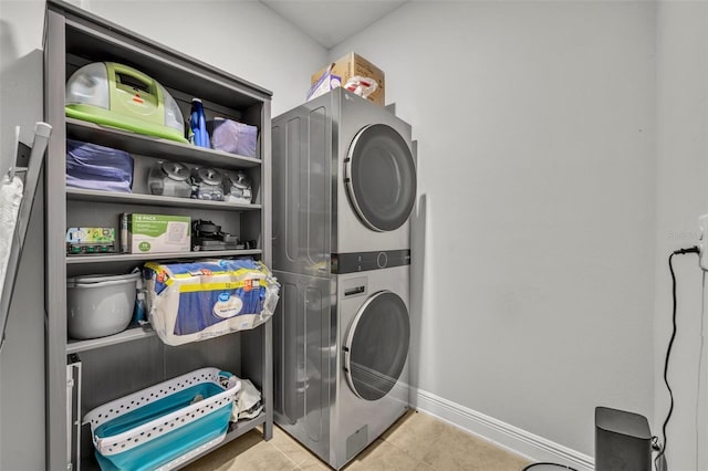 laundry room featuring stacked washer and clothes dryer