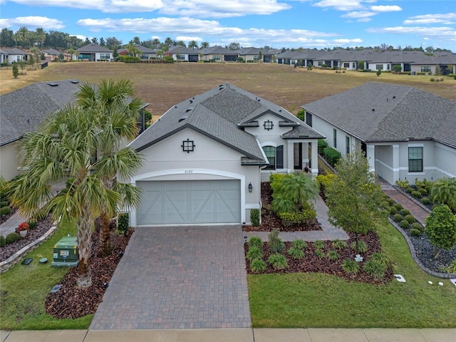 view of front facade featuring a garage and a front yard