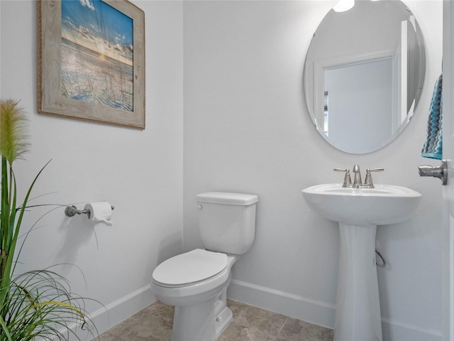 bathroom featuring tile patterned floors and toilet