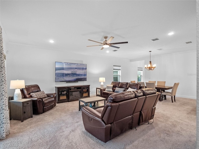 carpeted living room featuring ornamental molding and ceiling fan with notable chandelier