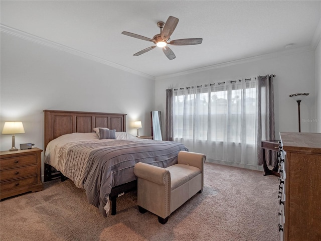 carpeted bedroom featuring crown molding and ceiling fan