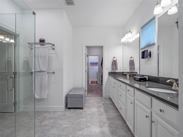 bathroom with vanity and an enclosed shower