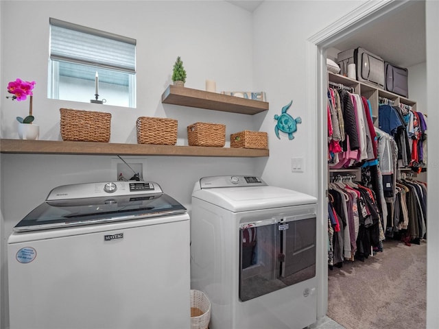 washroom featuring light colored carpet and washer and dryer