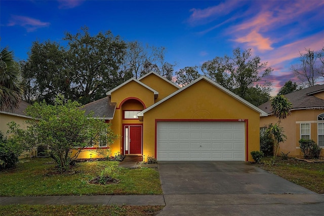 ranch-style home with a garage