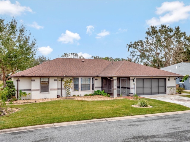 ranch-style home with a garage and a front lawn