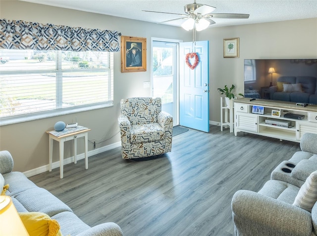 502 San Marino Dr, Lady Lake, FL 32159 - living room with hardwood / wood-style flooring, ceiling fan, and a textured ceiling