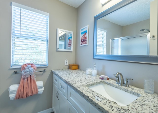 502 San Marino Dr, Lady Lake, FL 32159 - bathroom with a textured ceiling, a shower with door, and vanity
