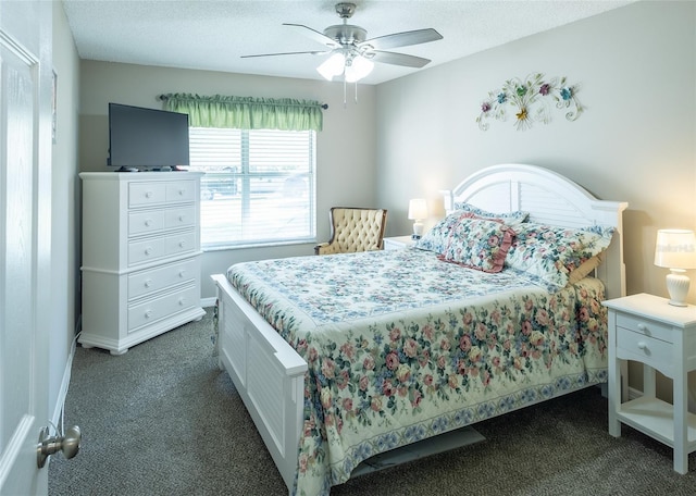 502 San Marino Dr, Lady Lake, FL 32159 - bedroom featuring dark carpet, ceiling fan, and a textured ceiling