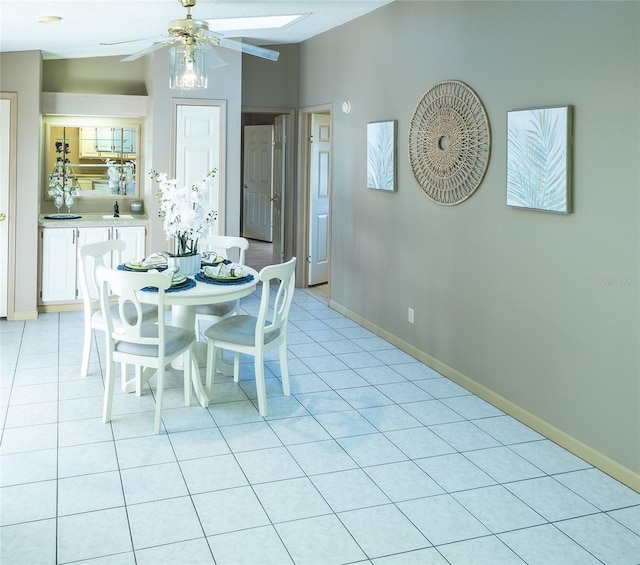 tiled dining area featuring ceiling fan