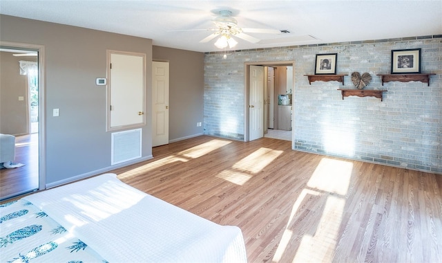 spare room with ceiling fan and light wood-type flooring