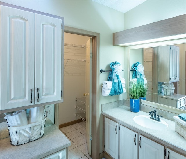 bathroom with vanity and tile patterned flooring
