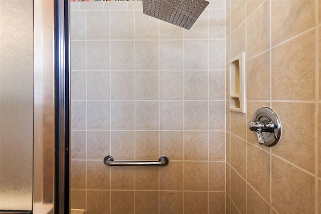 bathroom with tiled shower