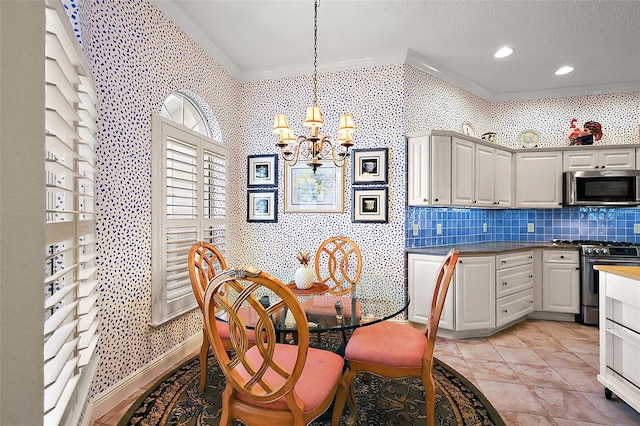 dining area featuring crown molding and a chandelier