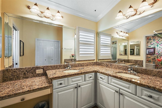 bathroom featuring vanity, crown molding, and vaulted ceiling