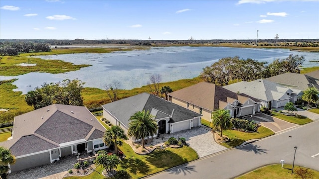 birds eye view of property featuring a residential view and a water view