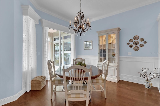 dining space featuring crown molding and dark wood-type flooring