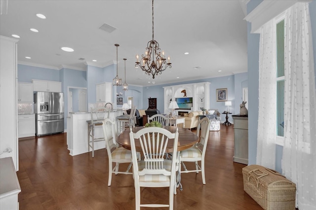 dining room featuring recessed lighting, crown molding, dark wood-style flooring, visible vents, and an inviting chandelier