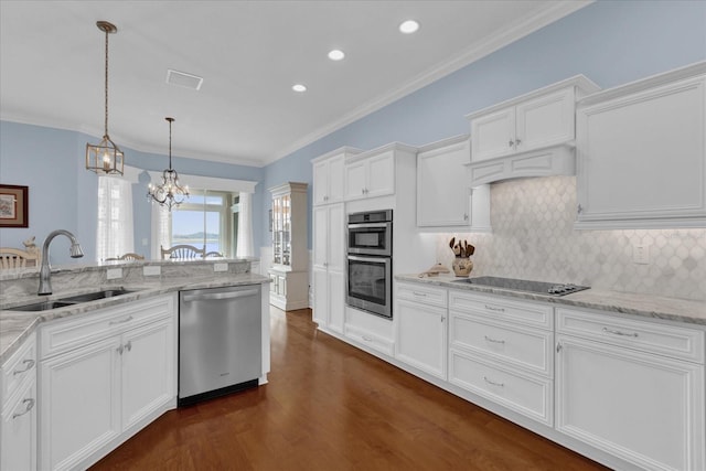 kitchen featuring stainless steel appliances, white cabinetry, and dark hardwood / wood-style floors